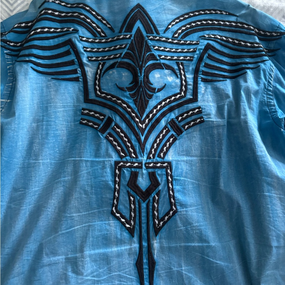 Roar Vibrant Blue Shirt with Black Accents
Orange, purple Roar
Blue Victorious